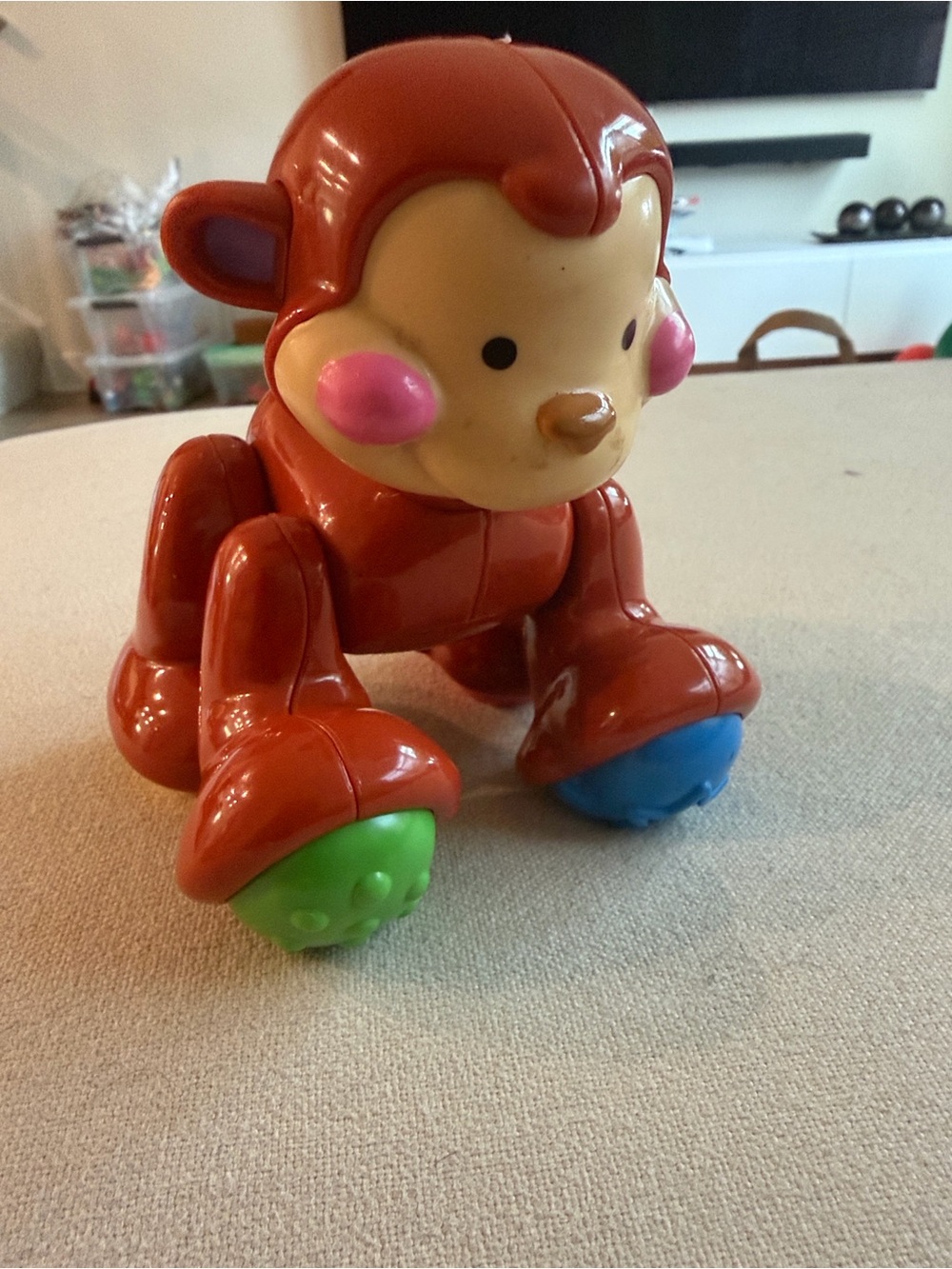 Fisher-Price Red Monkey Push Toy with Blue and Green Rollers
